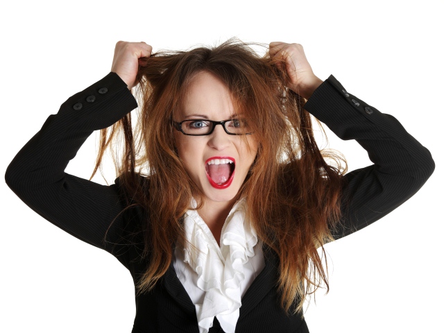 Angry woman tearing her hair